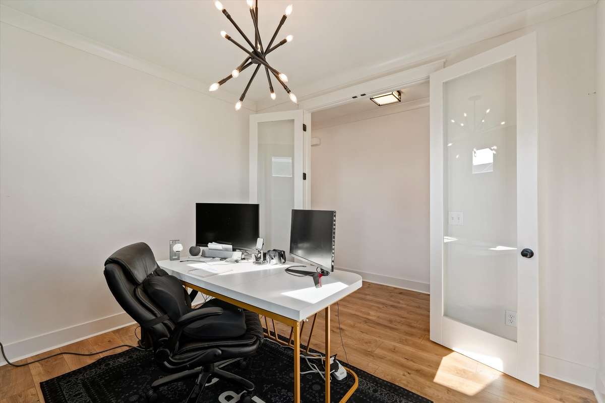 Retreat down the hall to your private home office with french doors