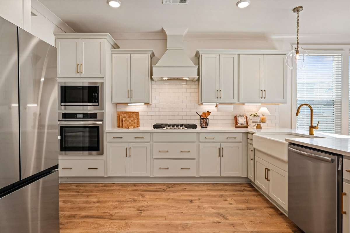 Tons of cabinet storage, under cabinet lighting, built-in microwave and oven, gas cooktop