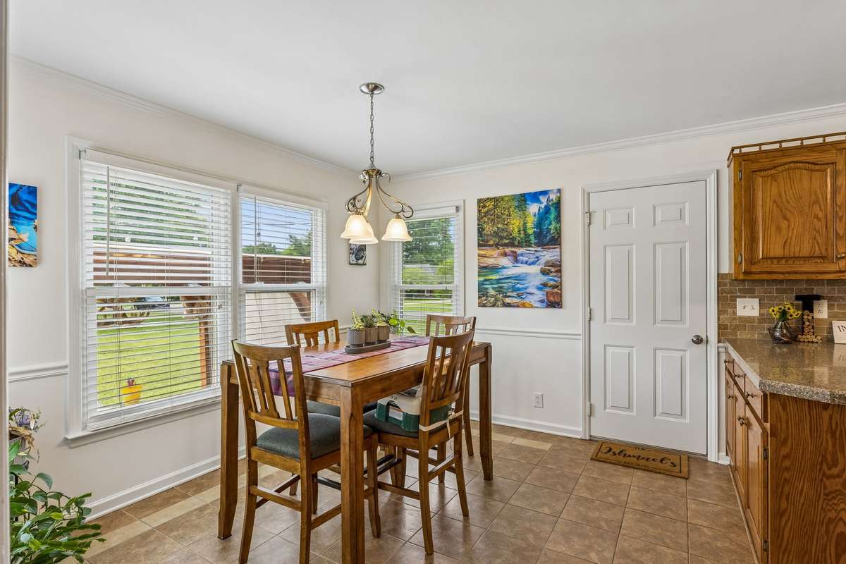 Roomy dining area in the kitchen overlooking your backyard with tile flooring. 2104 Red Mile Rd, Murfreesboro, TN 37127
