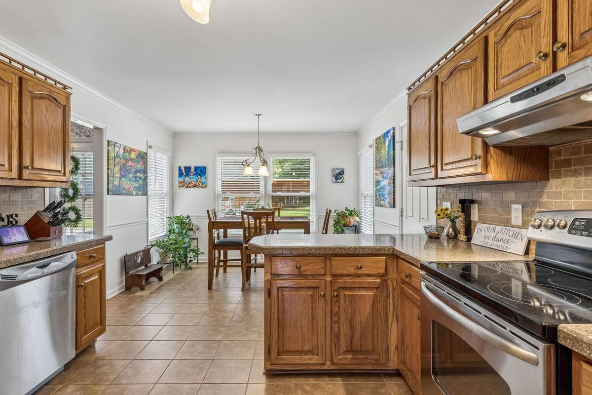 Kitchen has an abundance of cabinets and stainless steel appliances. 2104 Red Mile Rd, Murfreesboro, TN 37127