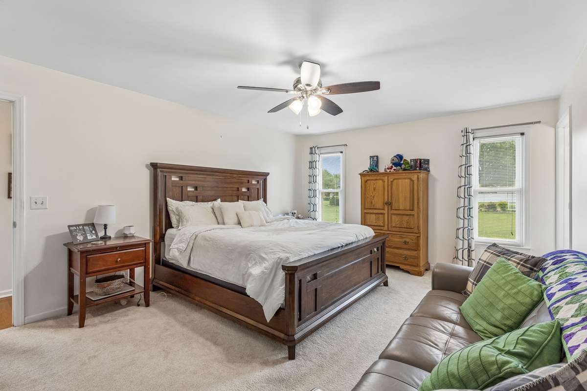 Primary bedroom is oversized and offers double windows and ceiling fan. 2104 Red Mile Rd, Murfreesboro, TN 37127