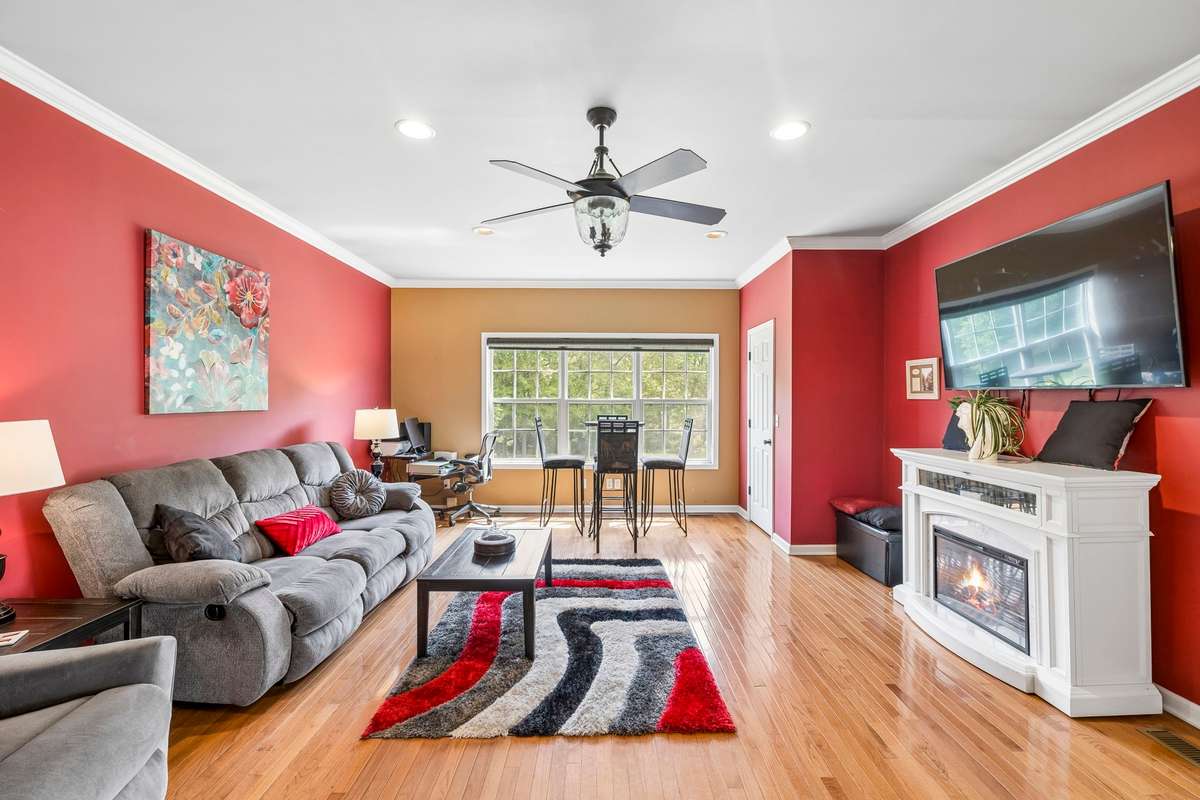 To the back right, the door is to the closet for this room. To have a room like this to enjoy, located on the main floor, makes it all the more usable instead of having to go upstairs typically for a Bonus Room!