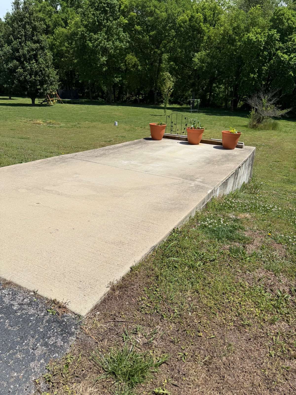 Here is the concrete driveway pad extension which may have been a place where the seller's boat was parked. Would be great for a camper as well!