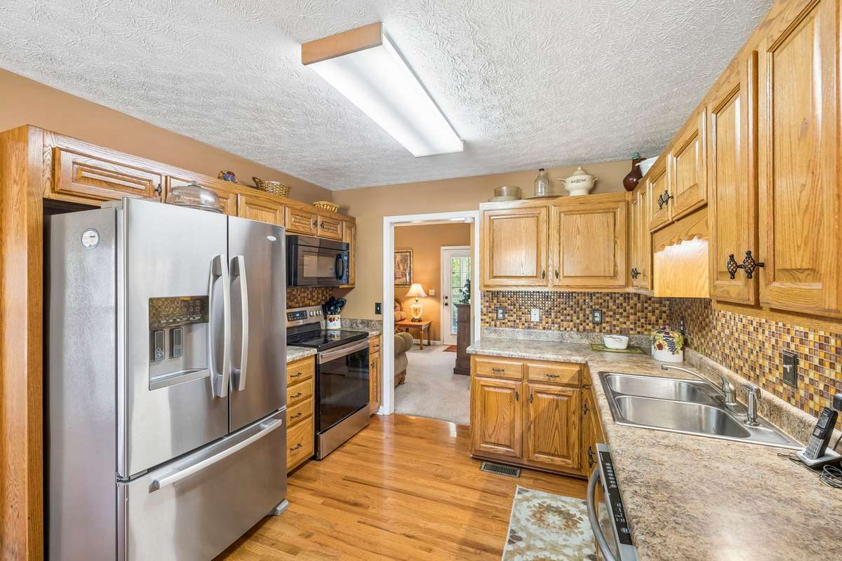 The Kitchen has the finished hardwood flooring; all Kitchen appliances will remain with the home!