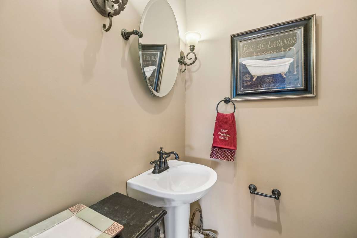 The half Bath located off the Bonus/Media/Family Room!
