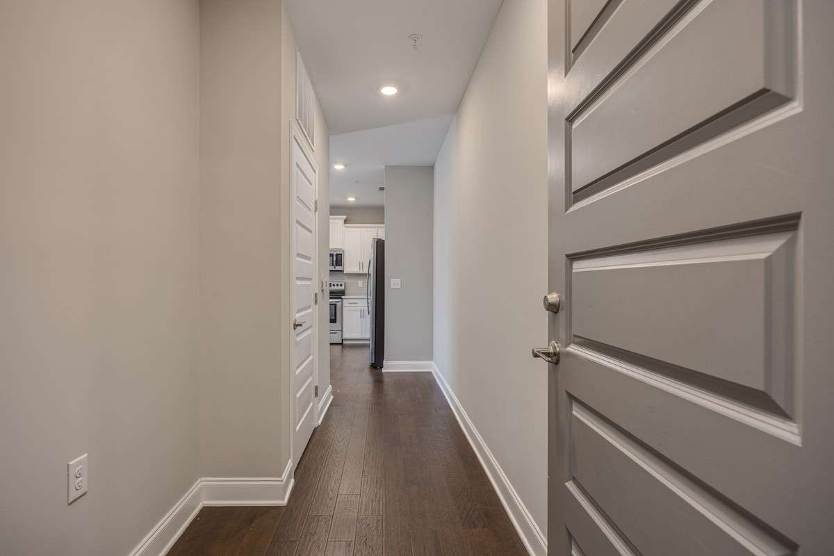 Entrance to condo. Space for bench or coat rack.