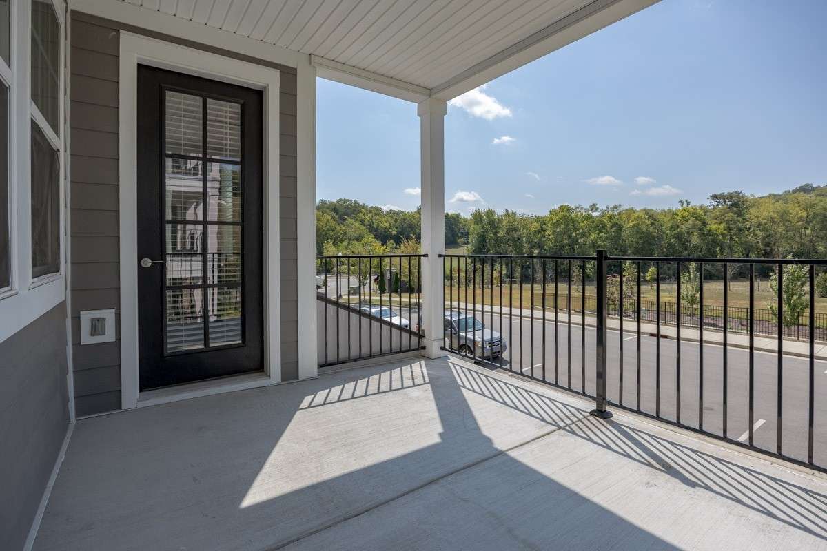 2nd floor balcony faces south west and overlooks farm land.