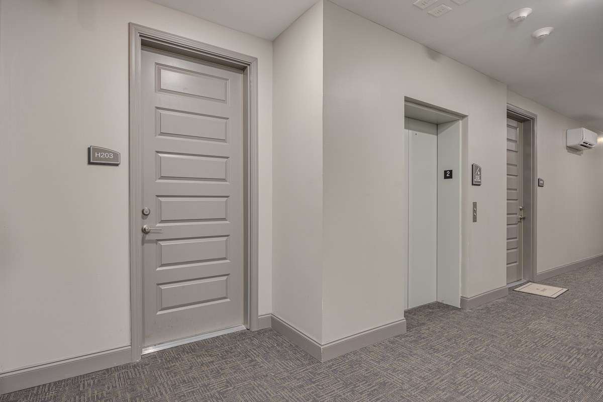 Front door just off elevator on second floor