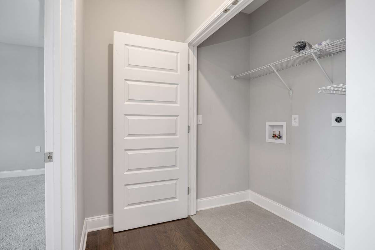 Spacious Laundry between kitchen and primary bedroom