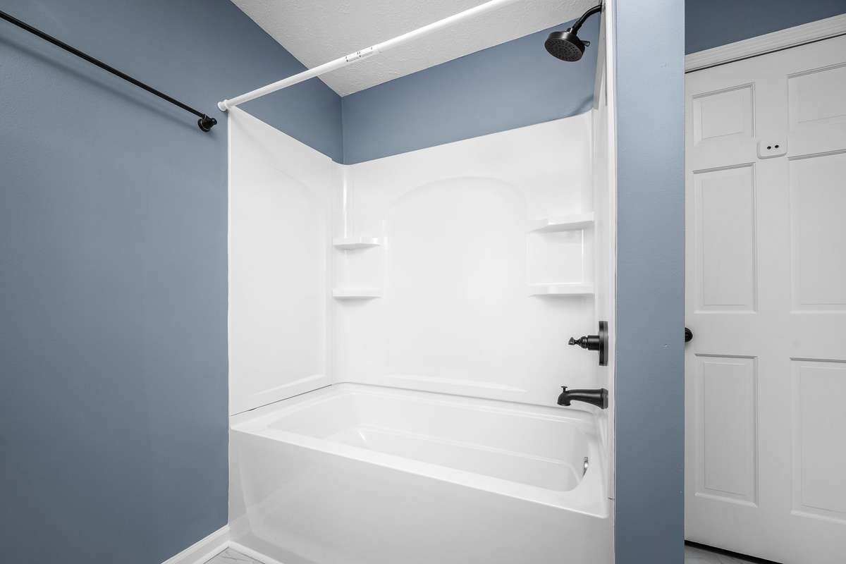 New tub/shower combo and toilet.