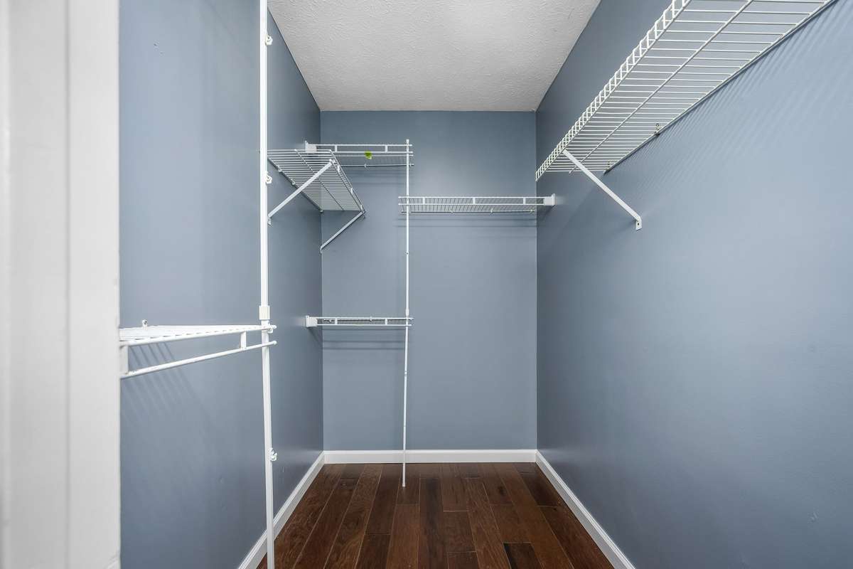 Walk-in closet in the primary bedroom.