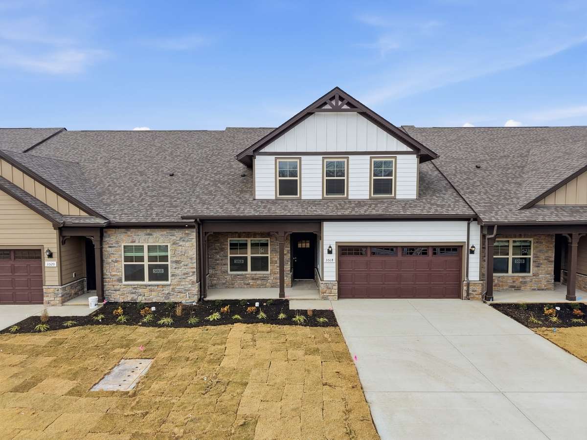File photo NEW middle unit 3/3, 2 car, 2 bedrms down/2 bath, 1 bedrm/bath up, great rm/kitchen, covered back porch, patio/Blinds/stainless pkg/refrigerator/kitchen Tile backsplash/under cabinet lighting/Owners Tile shower/laminate/carpet/tile & more!