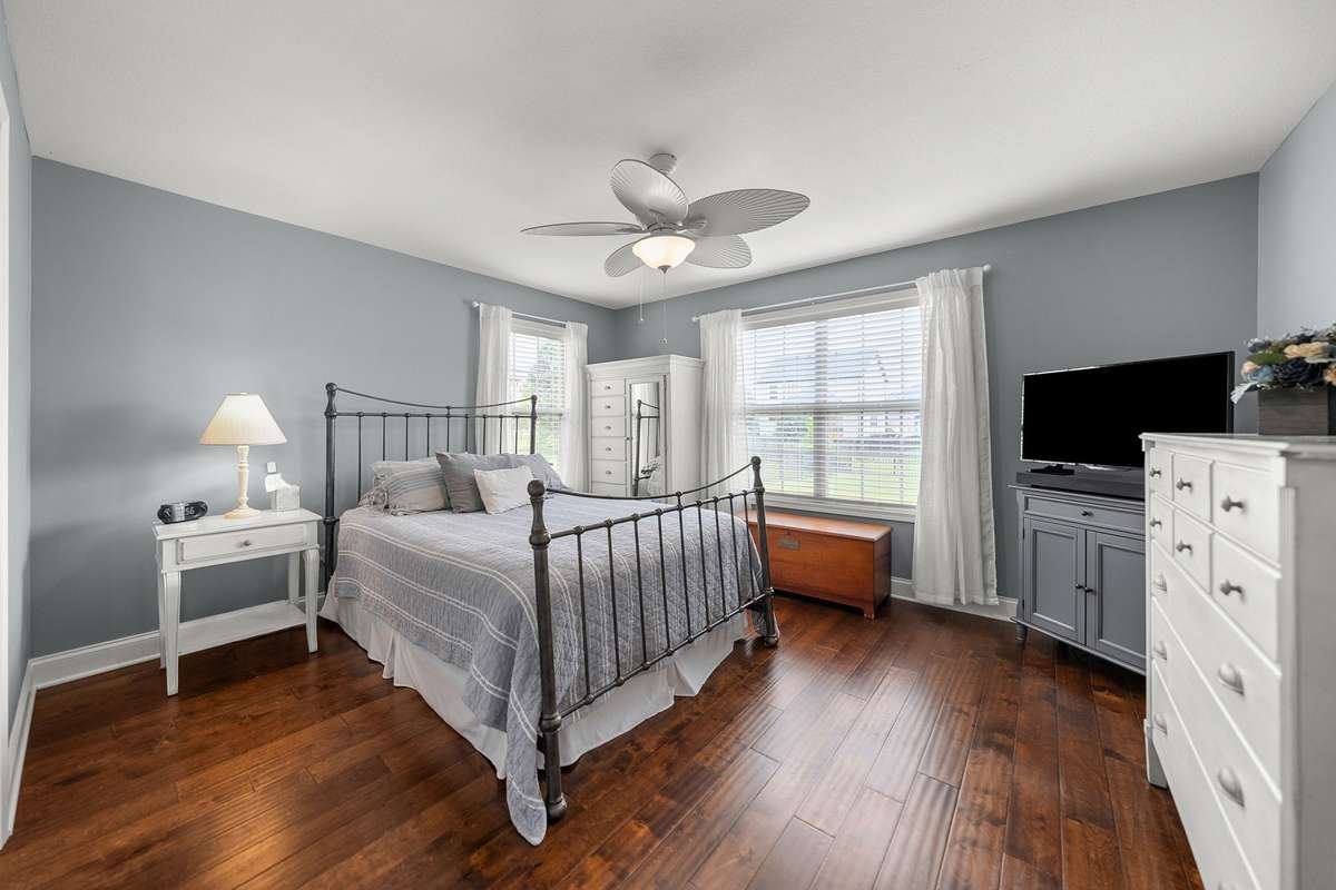 Primary Bedroom on the main floor with beautiful hardwood flooring!