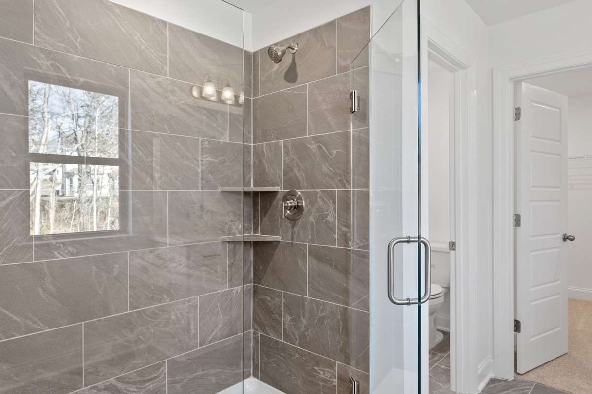 Separate Vanities, Tile Shower + Quartz Countertops in Primary Bath