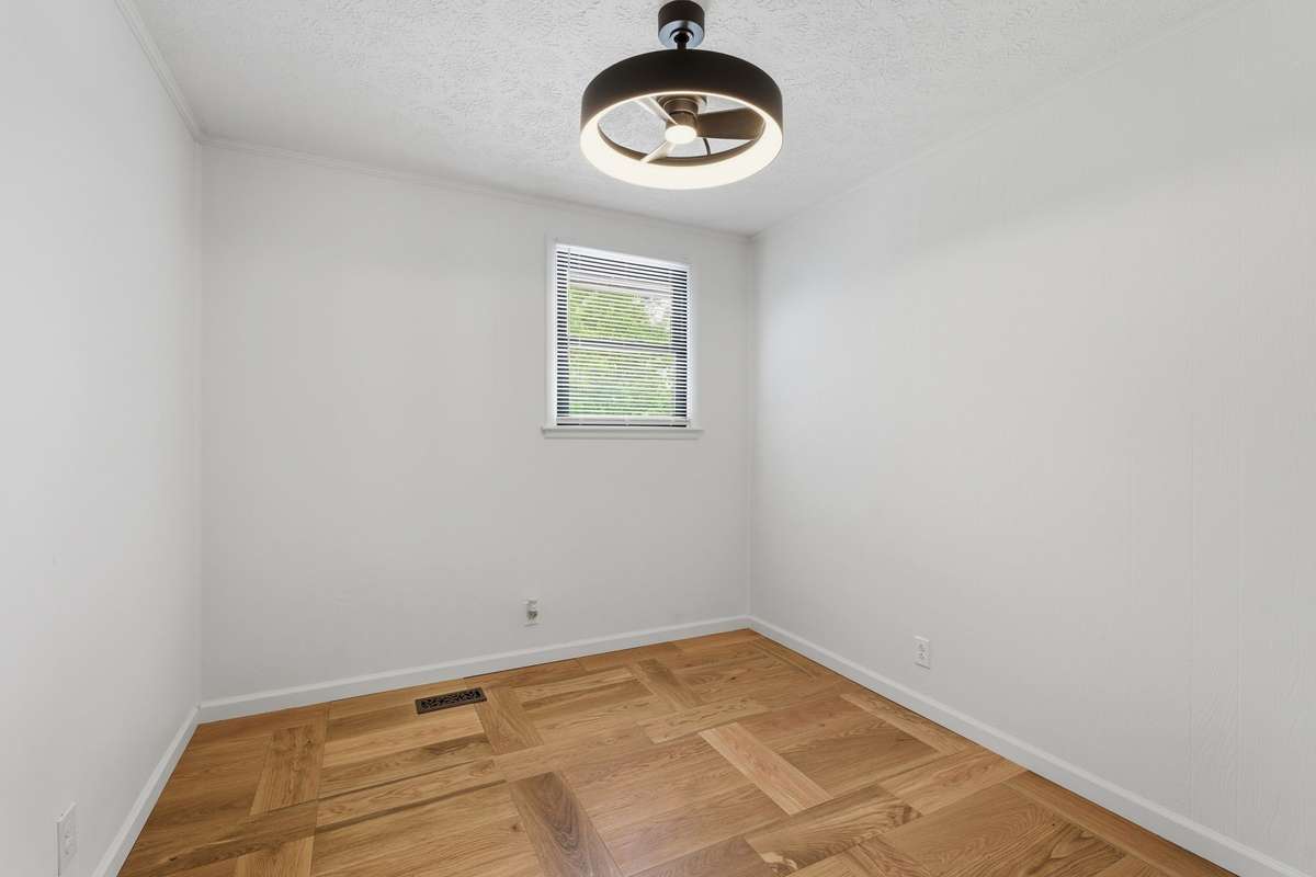 Bedroom with bright white paint and new lighting