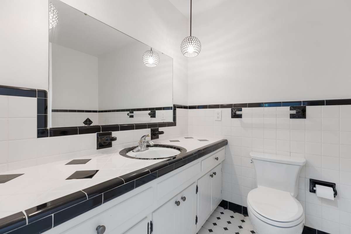 Vintage tile gives this secondary bathroom lots of charm and character