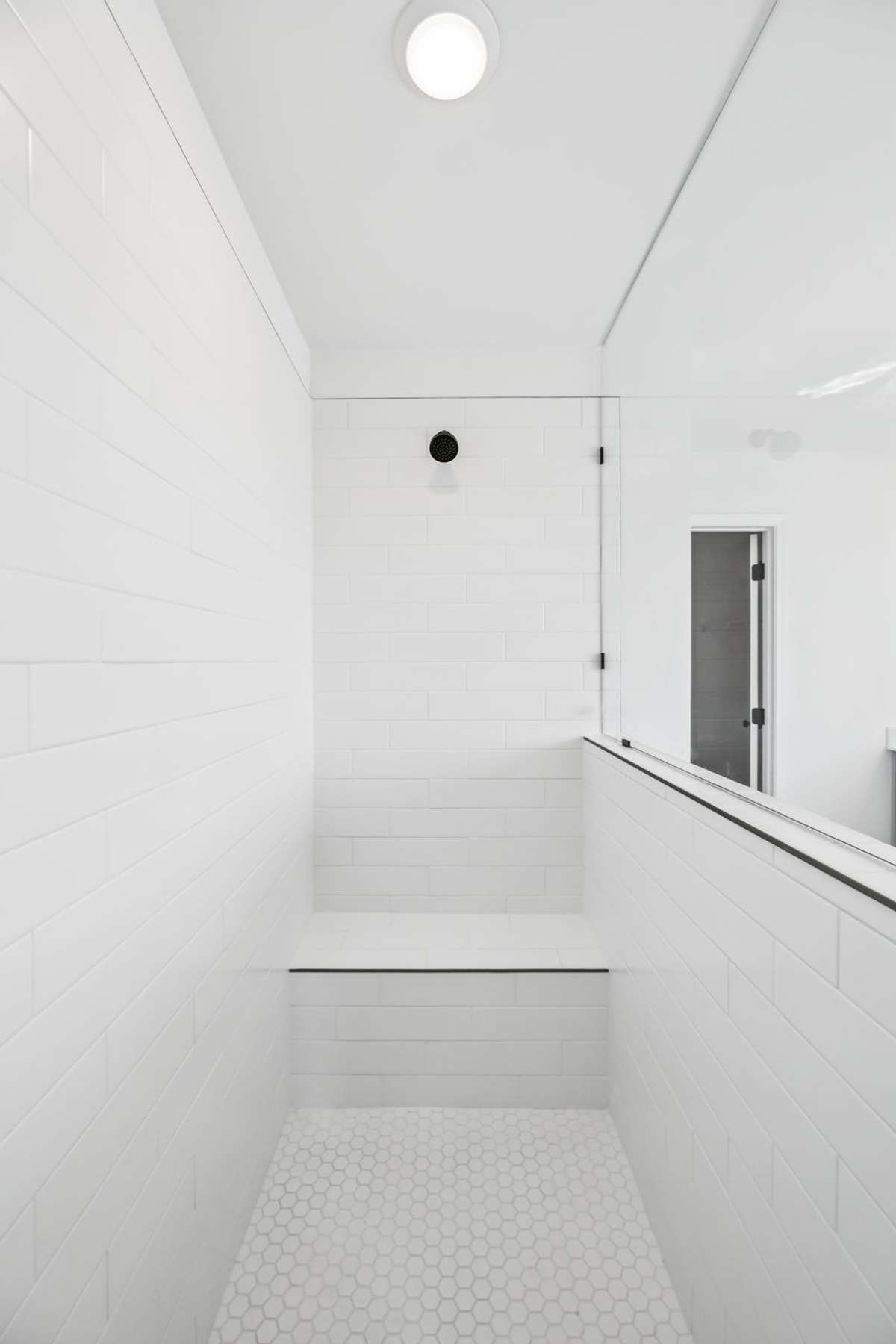 The "Deluxe Primary Bath" also includes a massive, tiled shower with built in bench. This is something you have to see in person as pictures do not do it justice!