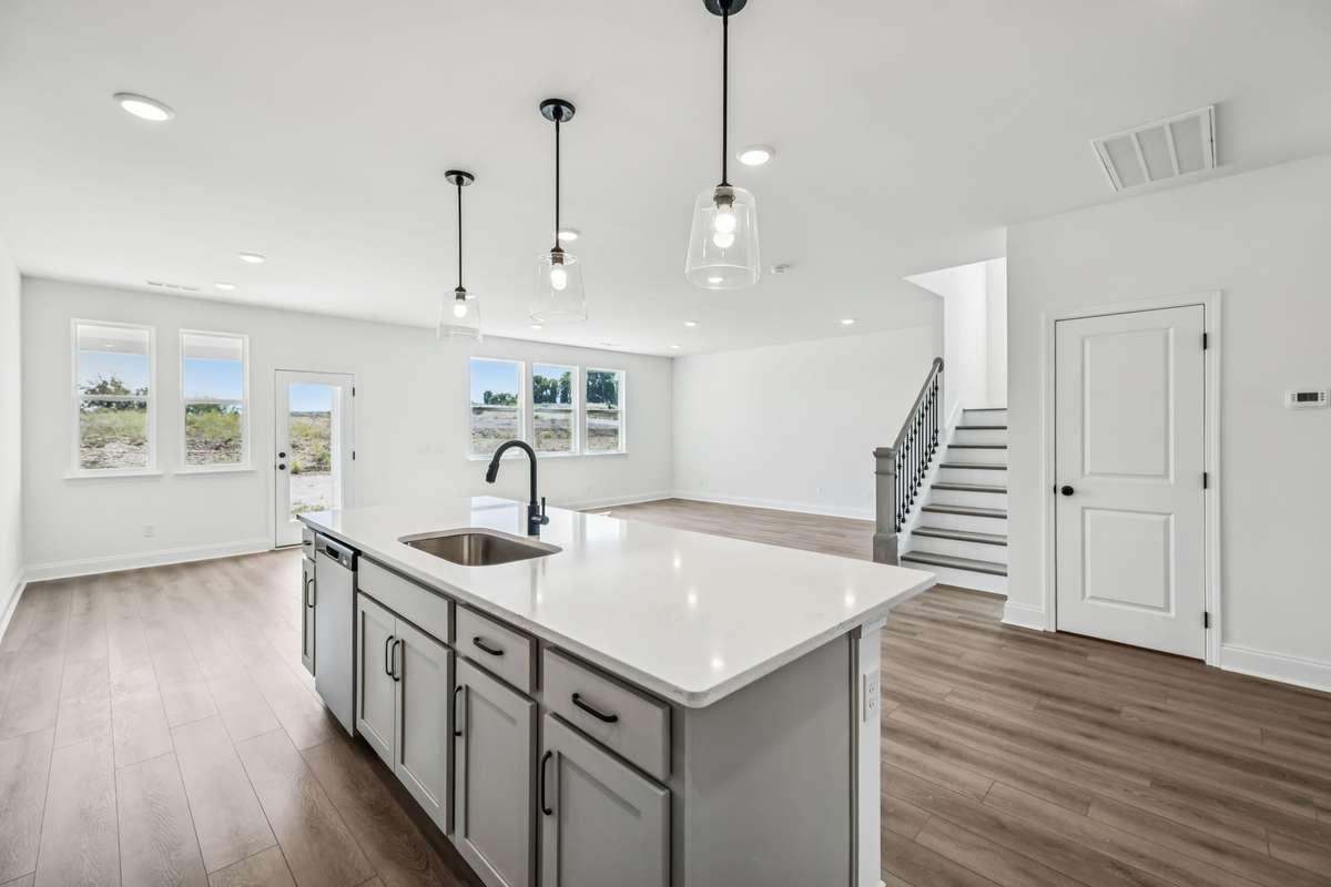 *Photos are from a previous Jordan Floorplan - Colors may vary*

The Kitchen in the "Jordan" is also designed to flow effortlessly into the Great Room and Breakfast Area, perfect for everyday living and when hosting others.