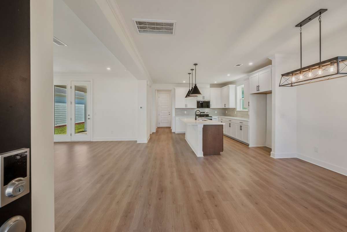 Open concept main level, perfect for entertaining!(Photos of similar home)
