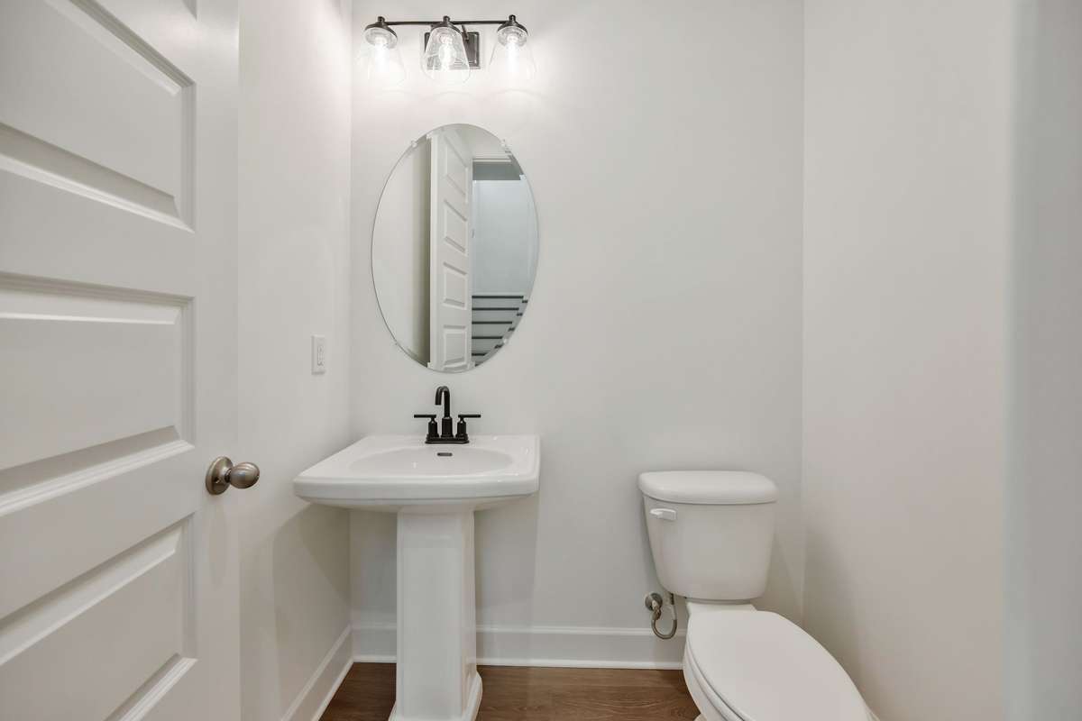Powder bathroom located on the main level.(Photos of similar home)
