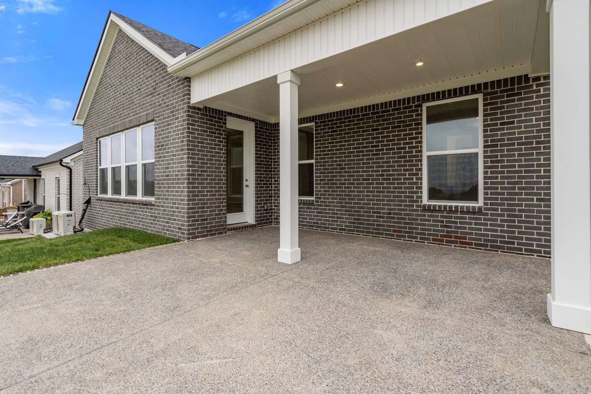Covered patio with added concrete.