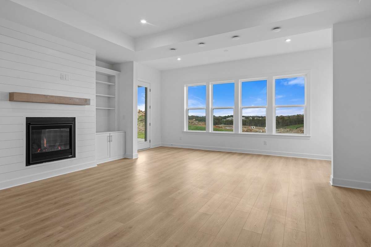 Gas shiplap fireplace and built in cabinetry.