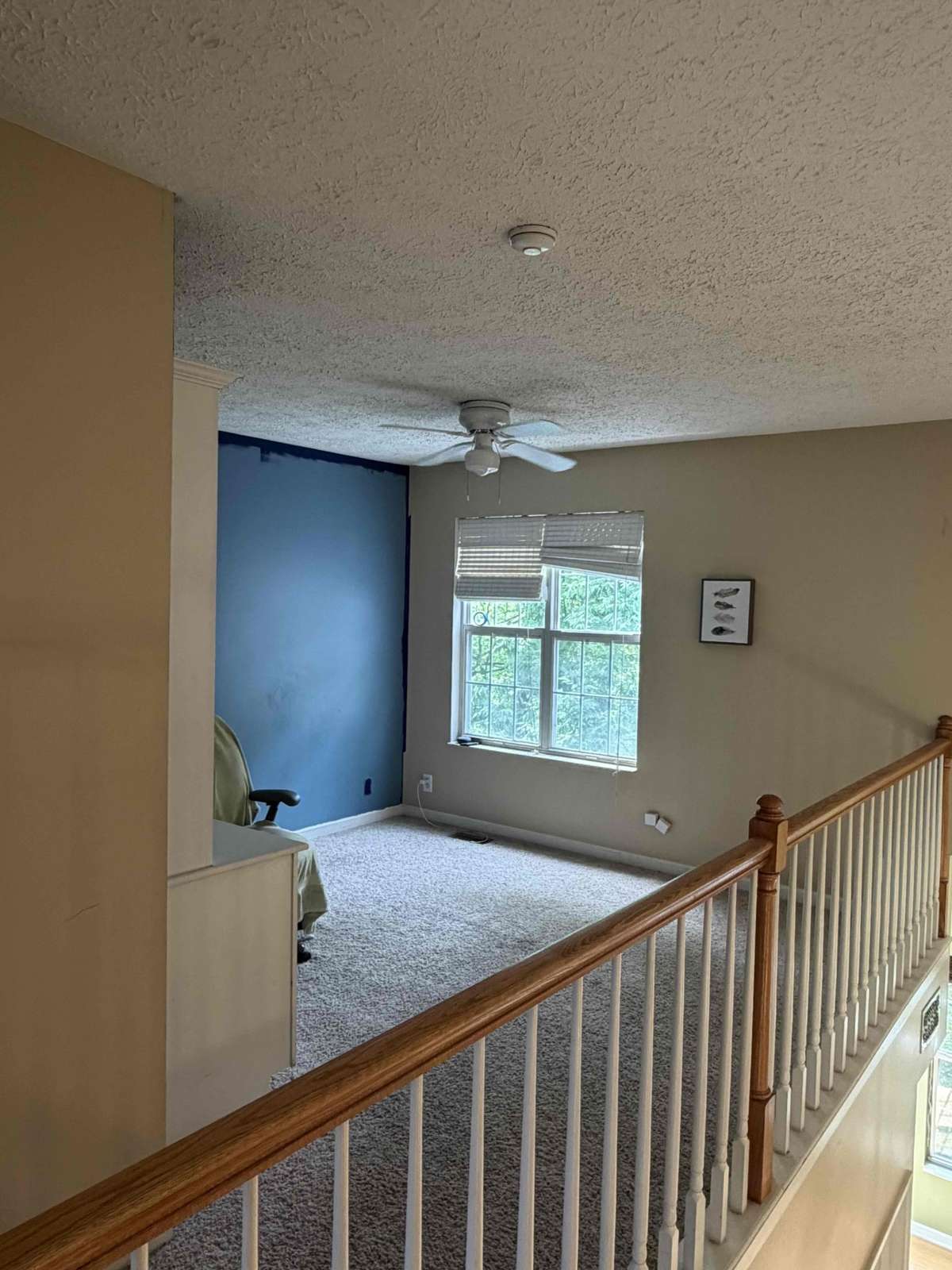 Upper-level loft or bonus space overlooking the main level, ideal for an office, playroom, or flex space.