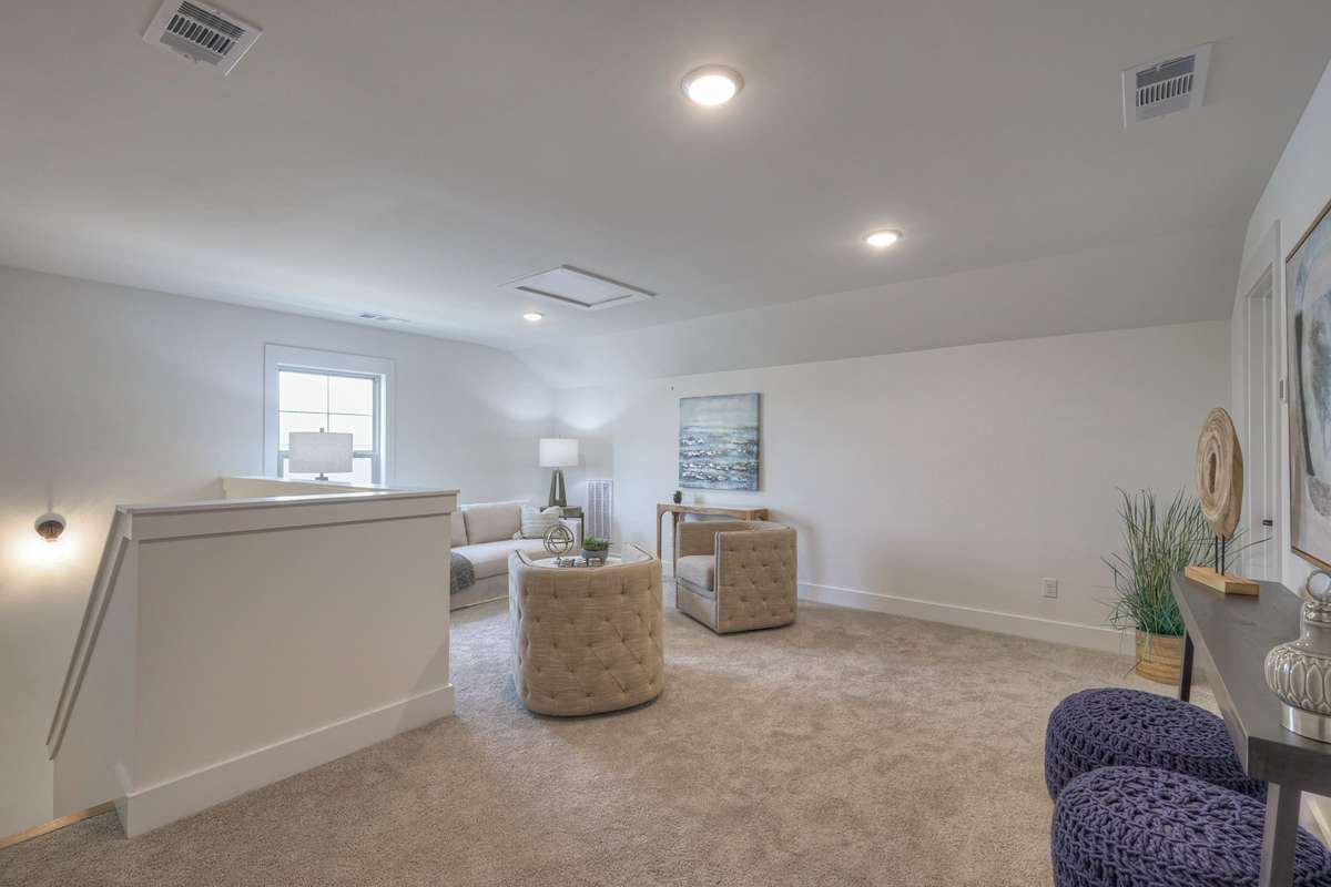 **Photos of the model home upstairs to show the layout of the floor plan staged with furniture. Not the actual house.**