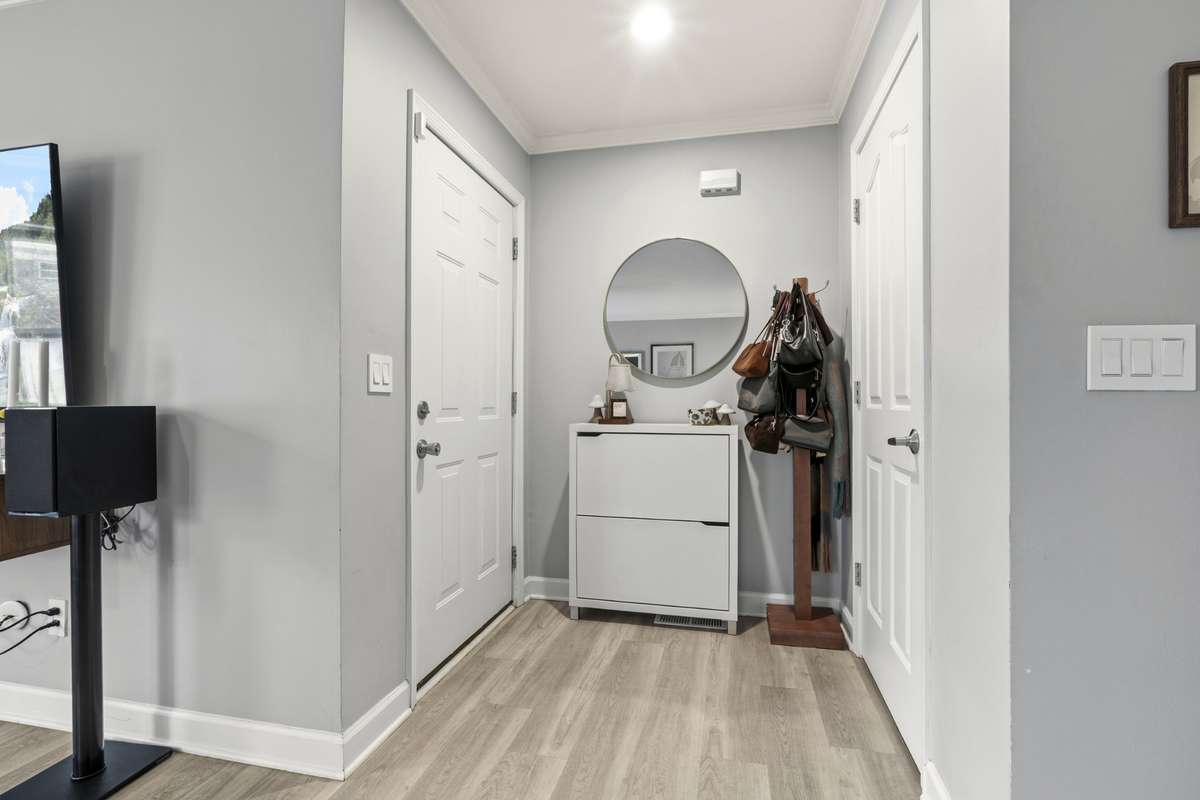 Welcoming entryway with stylish flooring and natural flow into the home.
