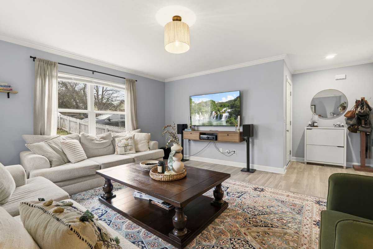 Another view of the inviting living room and entry area.