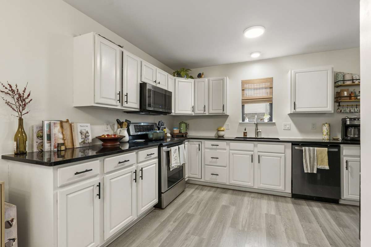 Spacious Kitchen featuring abundant cabinetry & plenty of counter space for cooking and entertaining.