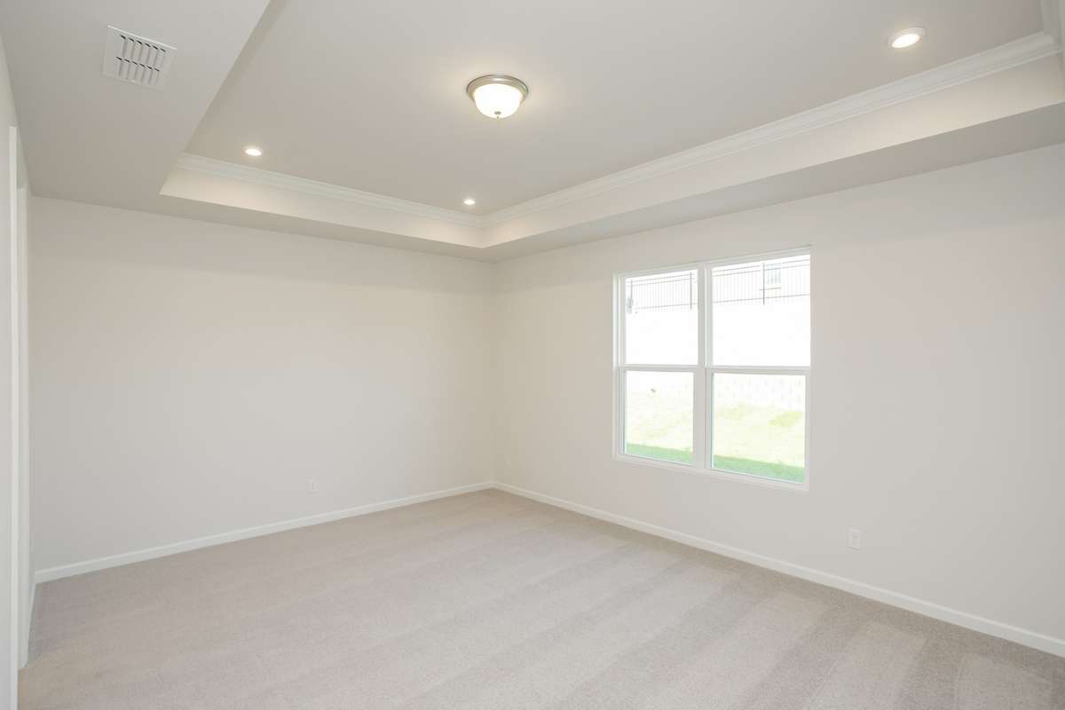 Primary Bedroom w/standard trey ceiling!