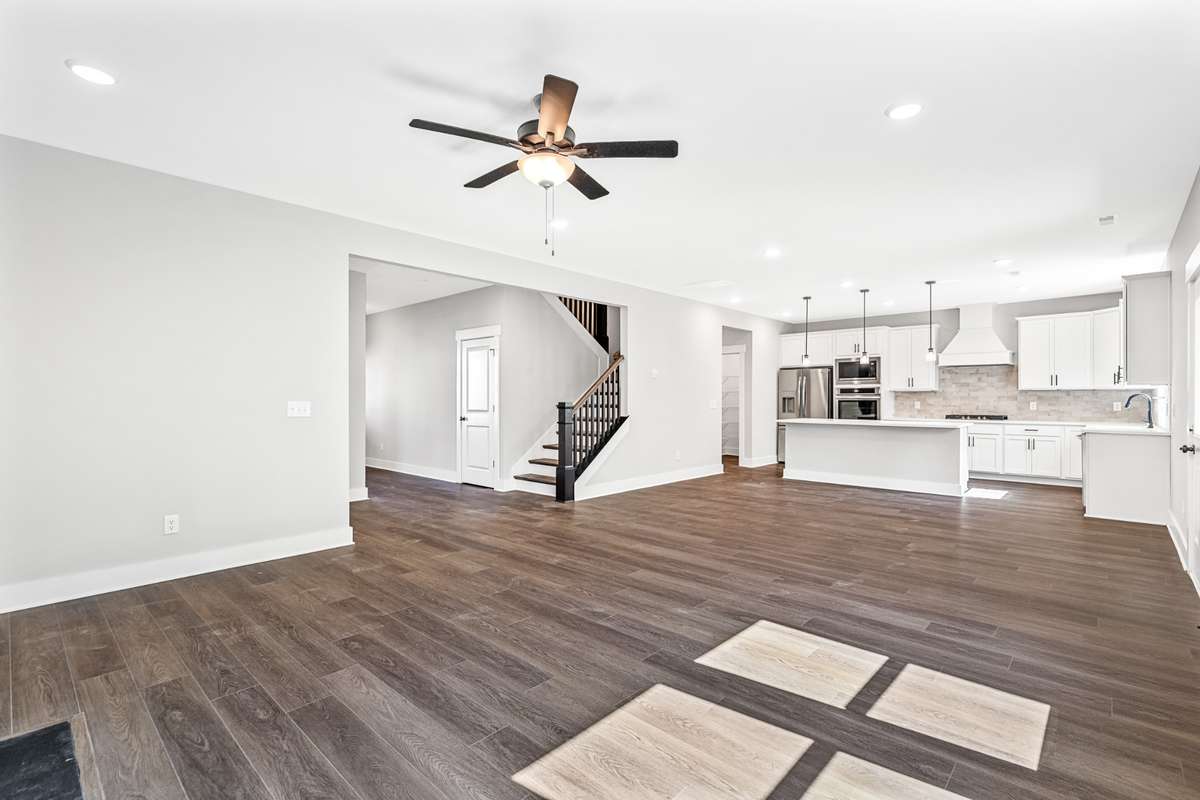 Model of the Henry floorplan.  Colors and selections may vary.  Gourmet kitchen with Hood and double ovens shown.  This option is available.