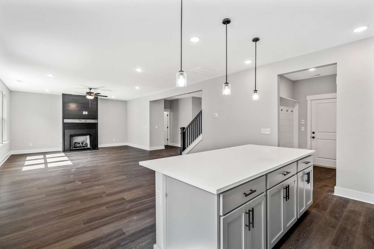 Model of the Henry floorplan.  Colors and selections may vary.  Gourmet kitchen with Hood and double ovens shown.  This option is available.
