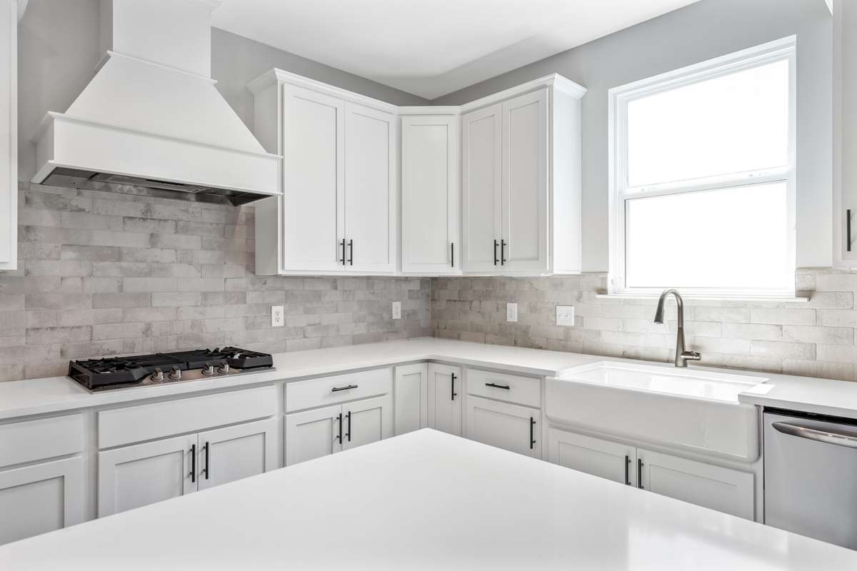 Model of the Henry floorplan.  Colors and selections may vary.  Gourmet kitchen with Hood and double ovens shown.  This option is available.