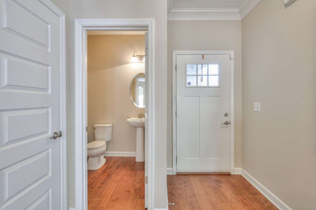 Entry foyer with view of half bath