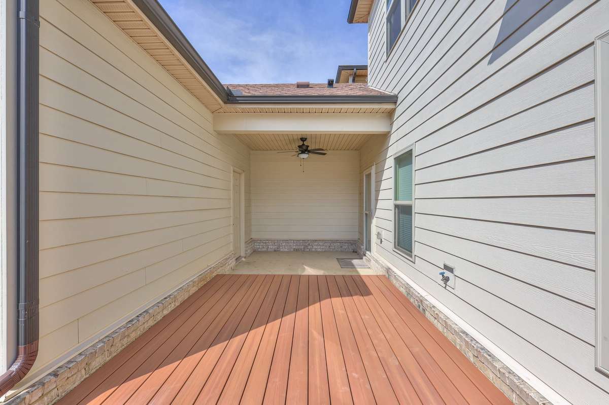 Covered area leads from house to garage
