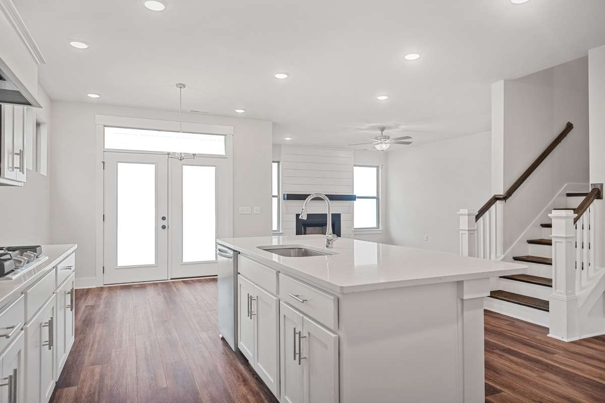 Picture of model home and not of actual home being built.   Home will have the gourmet kitchen setup like pictured with double ovens and hood vent.