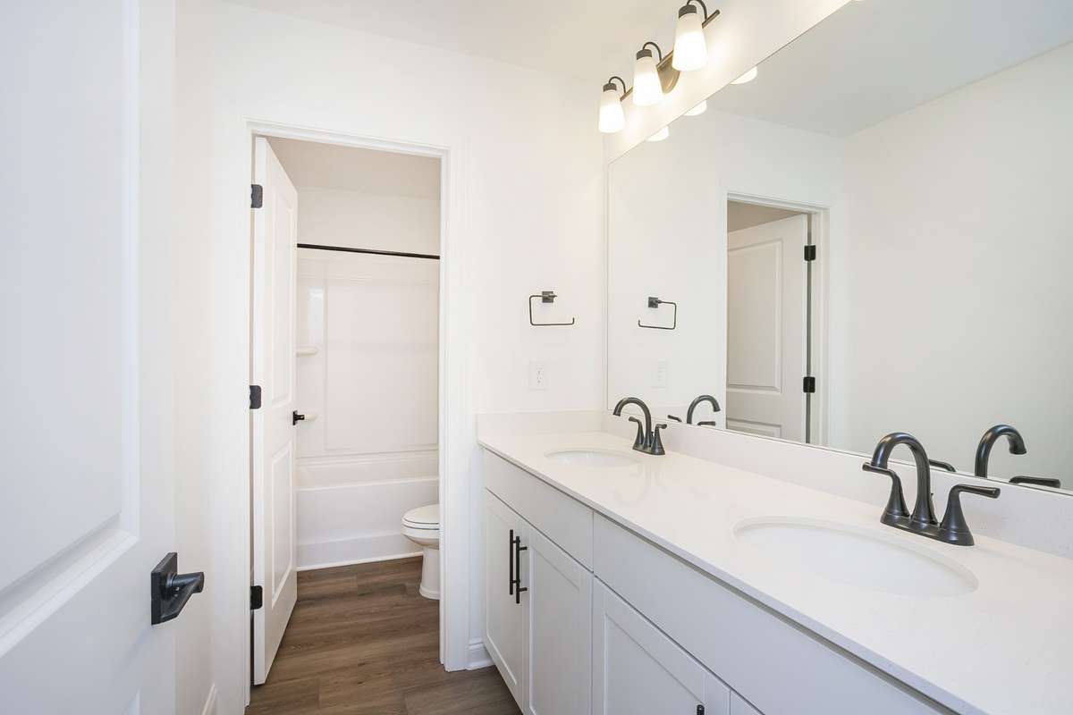Upstairs Bath with double vanity and seperate toilet/shower area