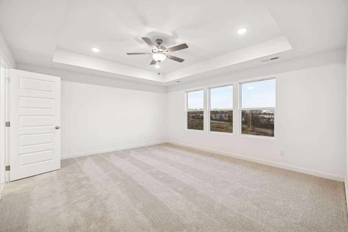 Picture of model home and not of actual home being built.  Oversized owners suite will also have tray ceiling and ceiling fan.