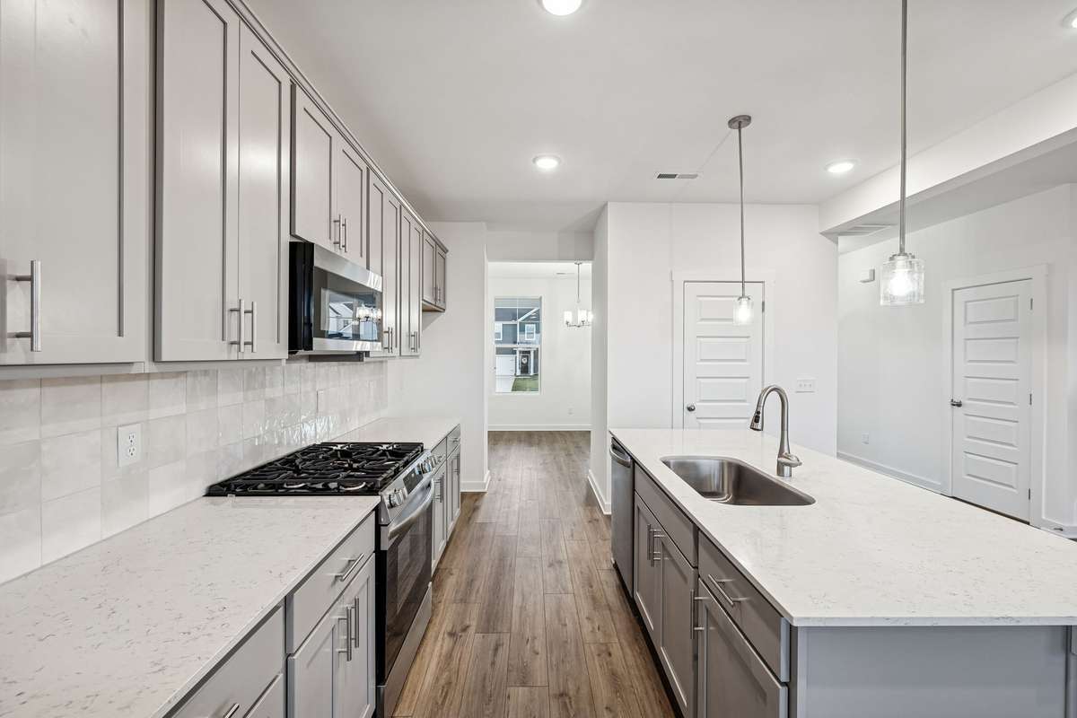 Picture of model home and not of actual home being built.  Cabinet colors for home is shown.