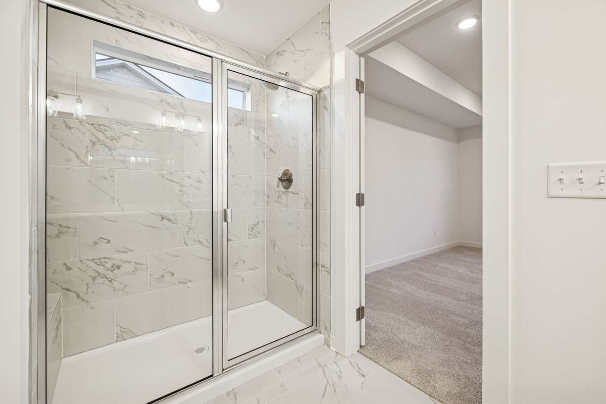 Picture of model home and not of actual home being built.  Tile shower with bench is also being built on this home.  Absolutely incredible Owners bathroom area.