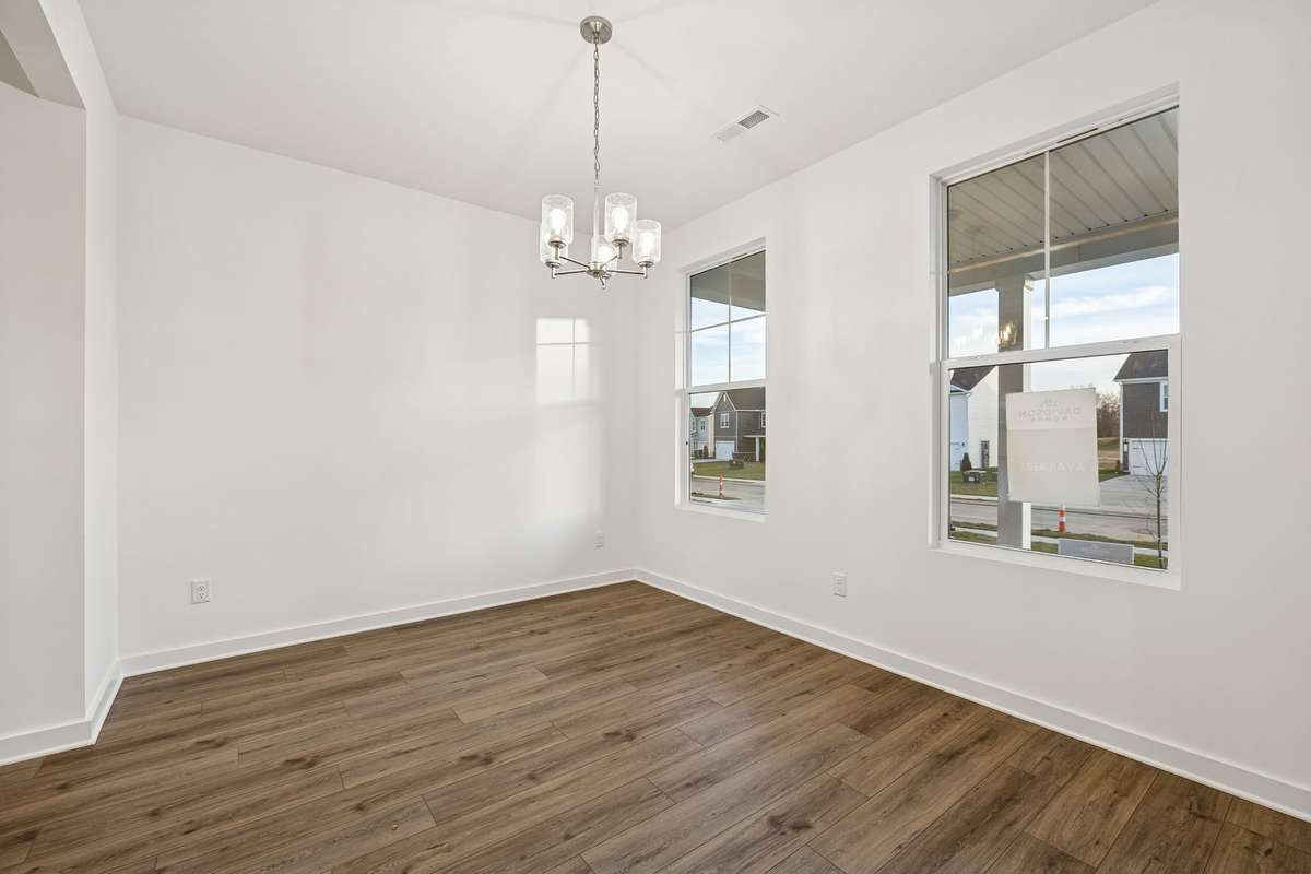 Picture of model home and not of actual home being built.  Beautiful dining area separate from kitchen.
