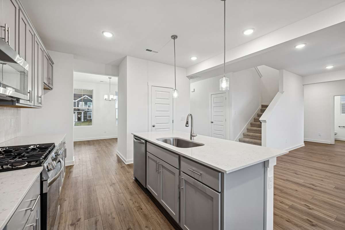 Picture of model home and not of actual home being built.  Cabinet colors for home is shown.