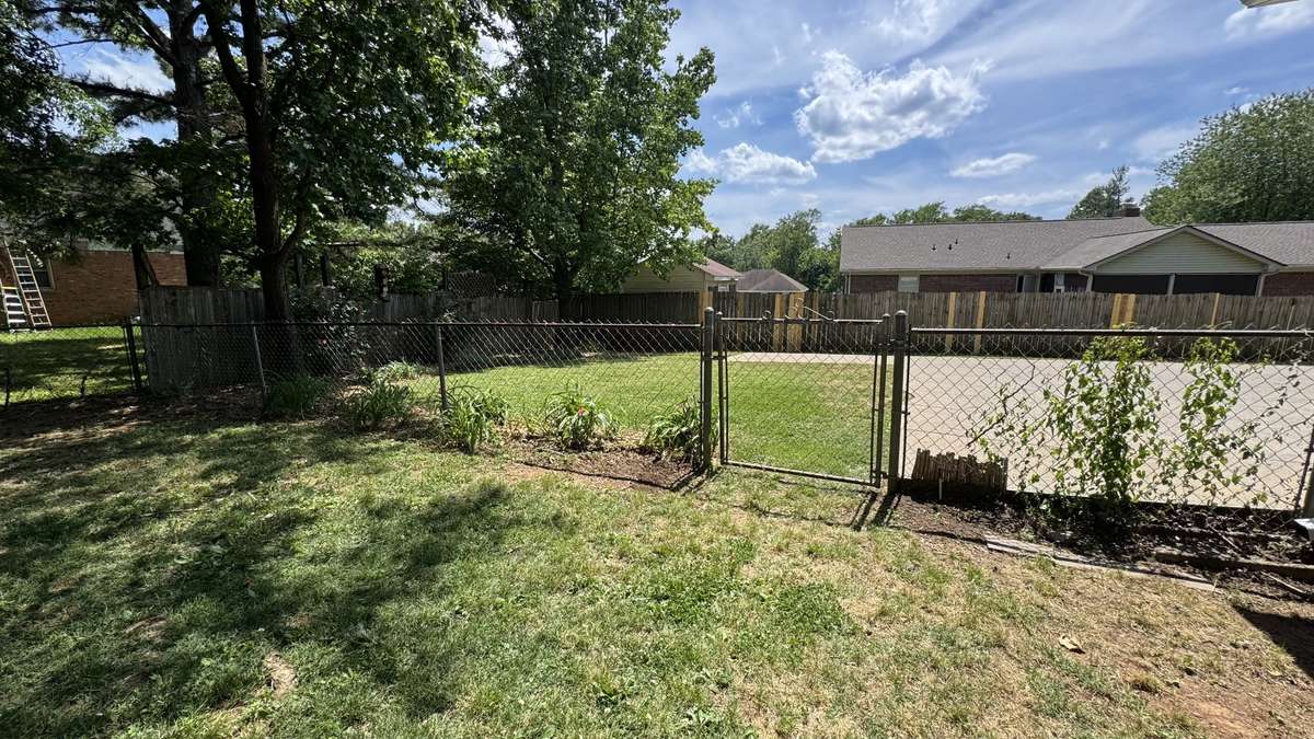 Backyard has beautiful flowers and landscaping.  Animals paradise.  Two Fenced in areas that feature park like settings for your dogs!!
