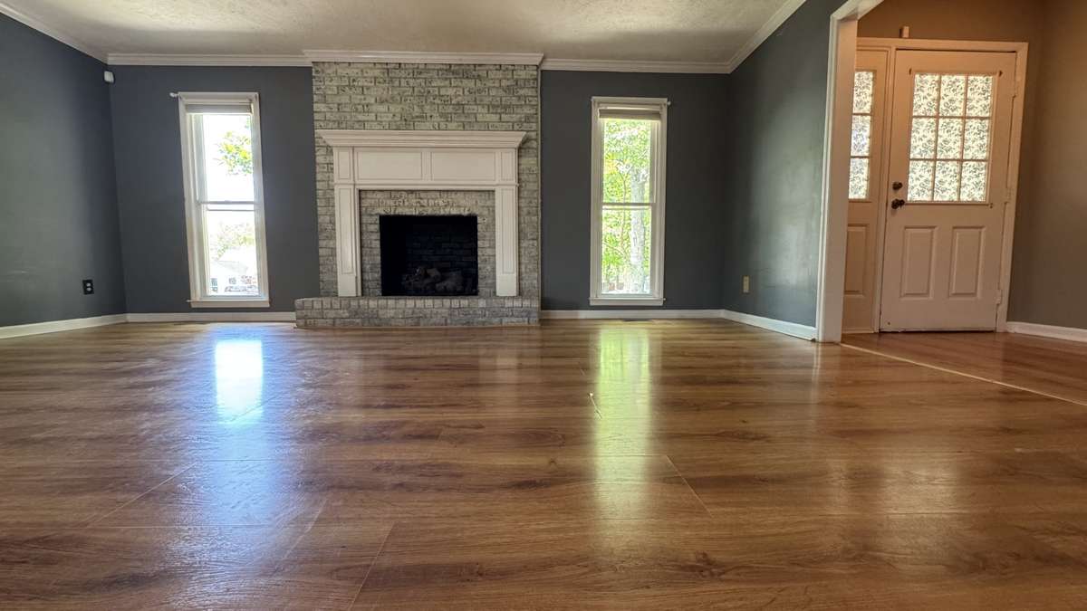 Cozy gas log fireplace.  Entry foyer to right of picture.  Ideal floorplan