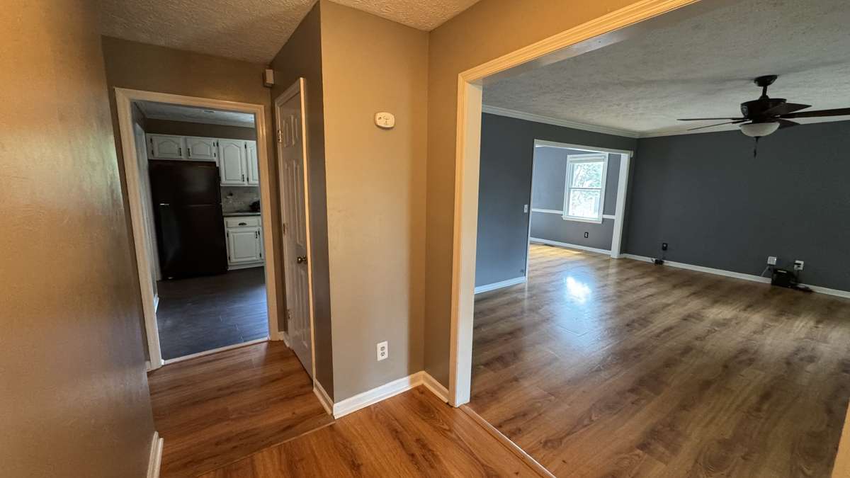 Foyer entry looking into kitchen and living room