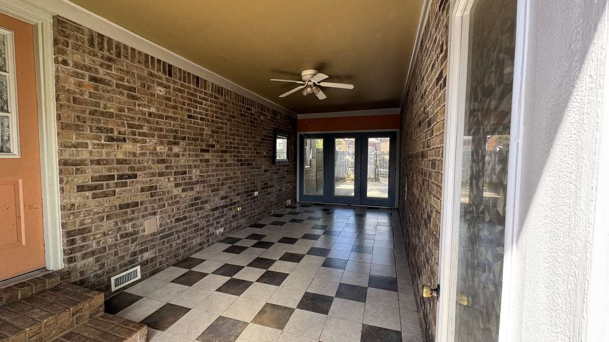 Access on both sides of florida room to private backyard and garage.