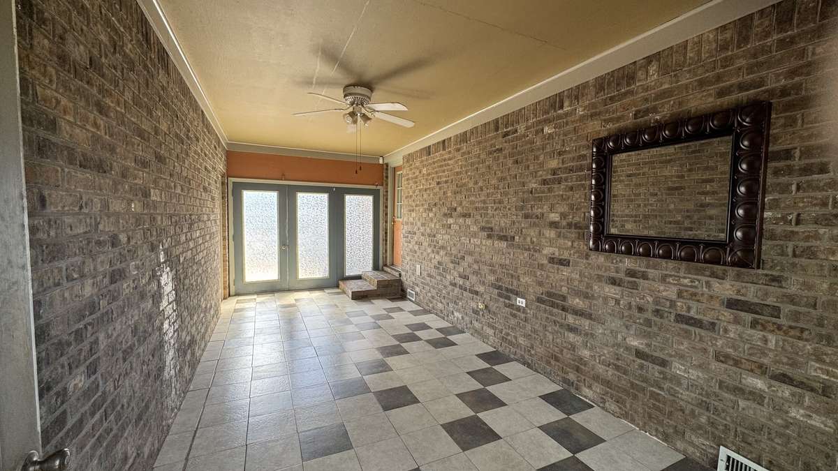 Florida room has access to backyard outside these doors.