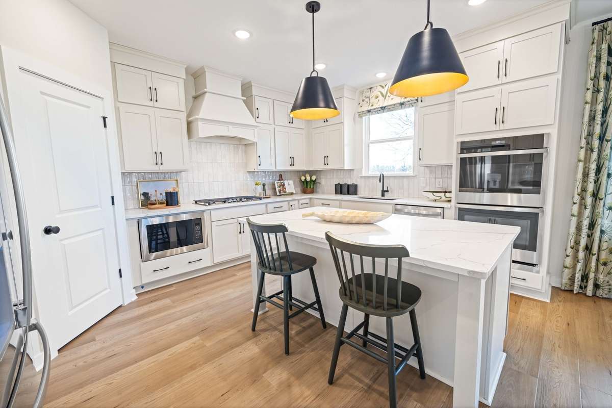 . All remaining pics are of another Wynwood in another location . Selections may not be the same. The kitchen layout is different in this community but still gorgeous!